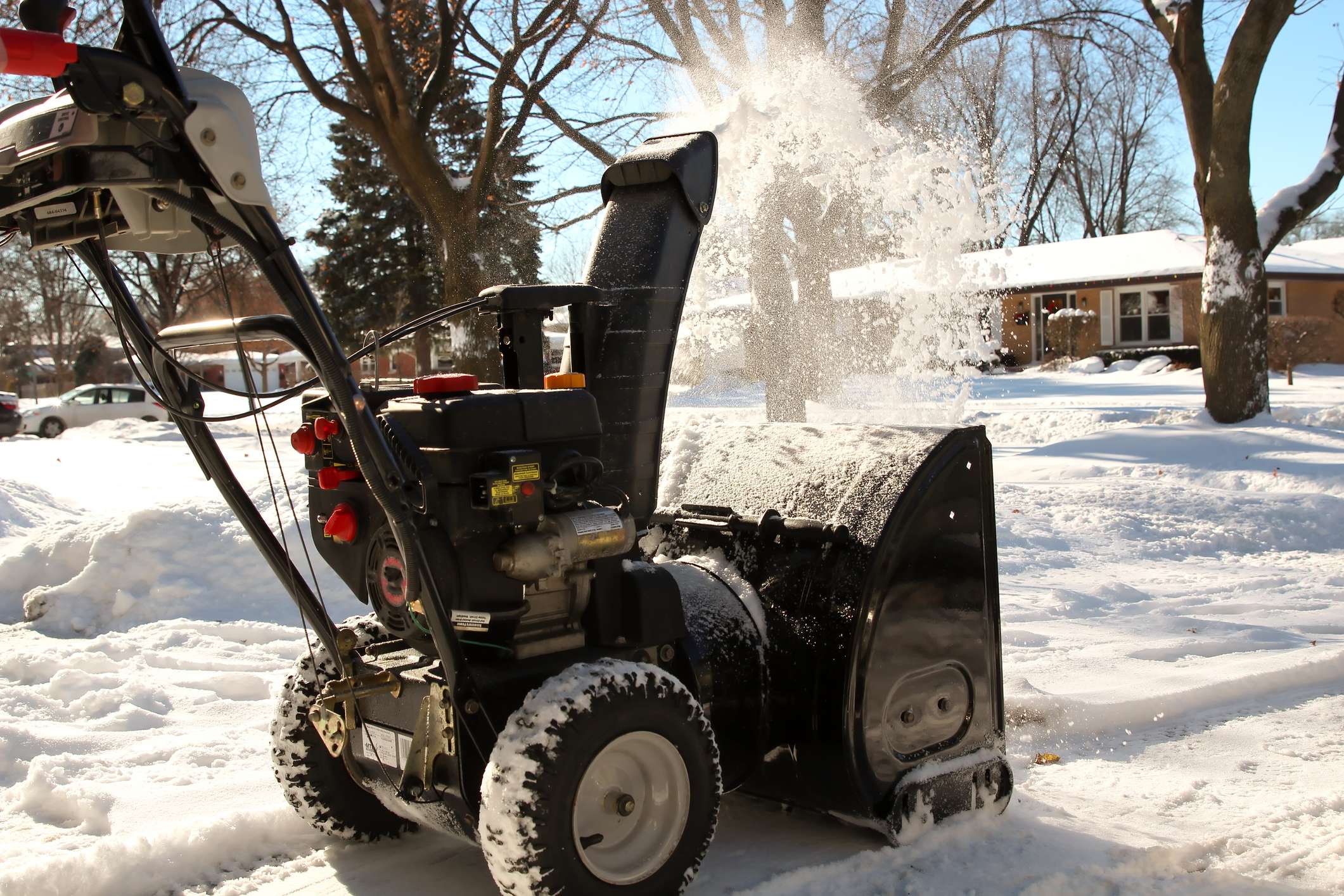 A man cleans snow